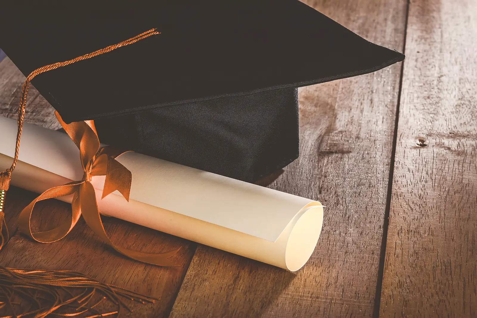 graduation cap and diploma