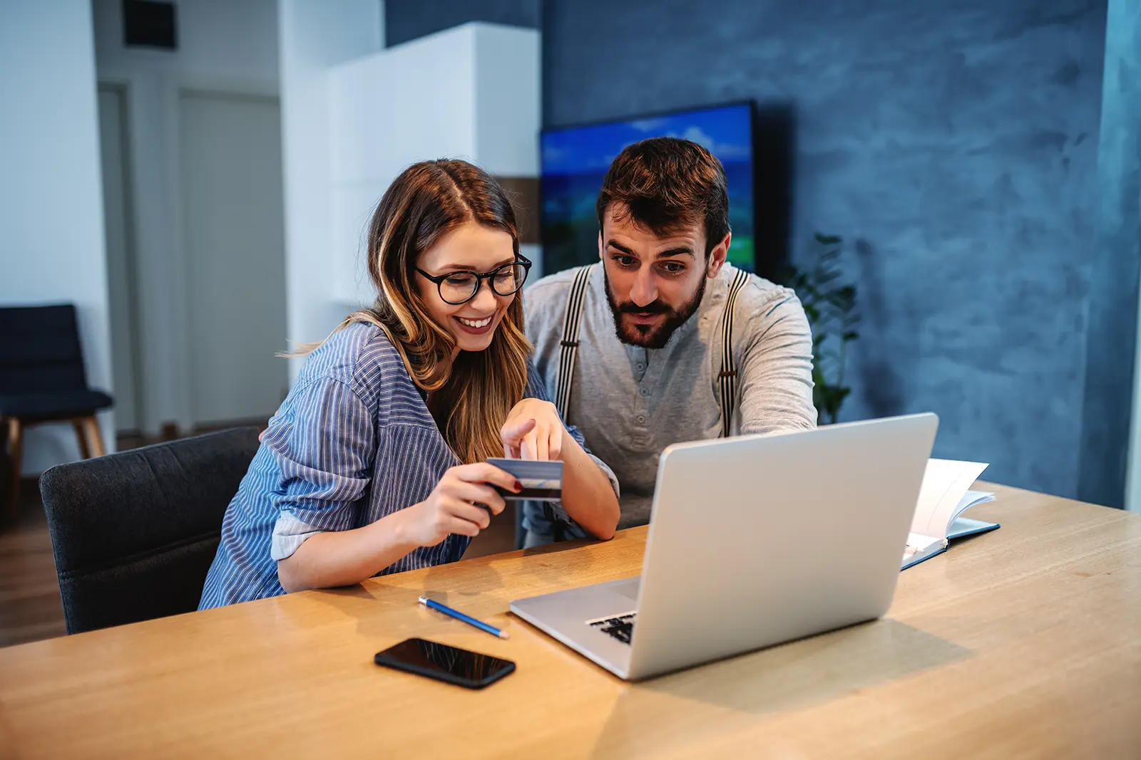 Couple managing credit card with digital banking